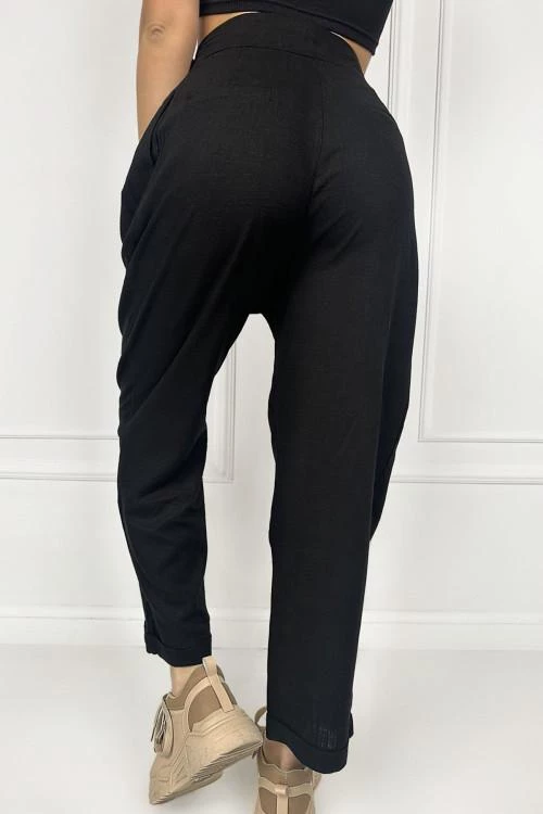 Women's trousers with asymmetric buttons