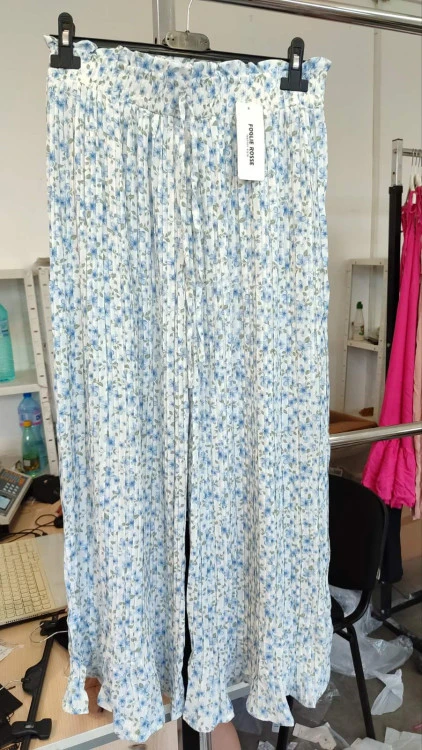 Women's trousers with a floral pattern and pleats